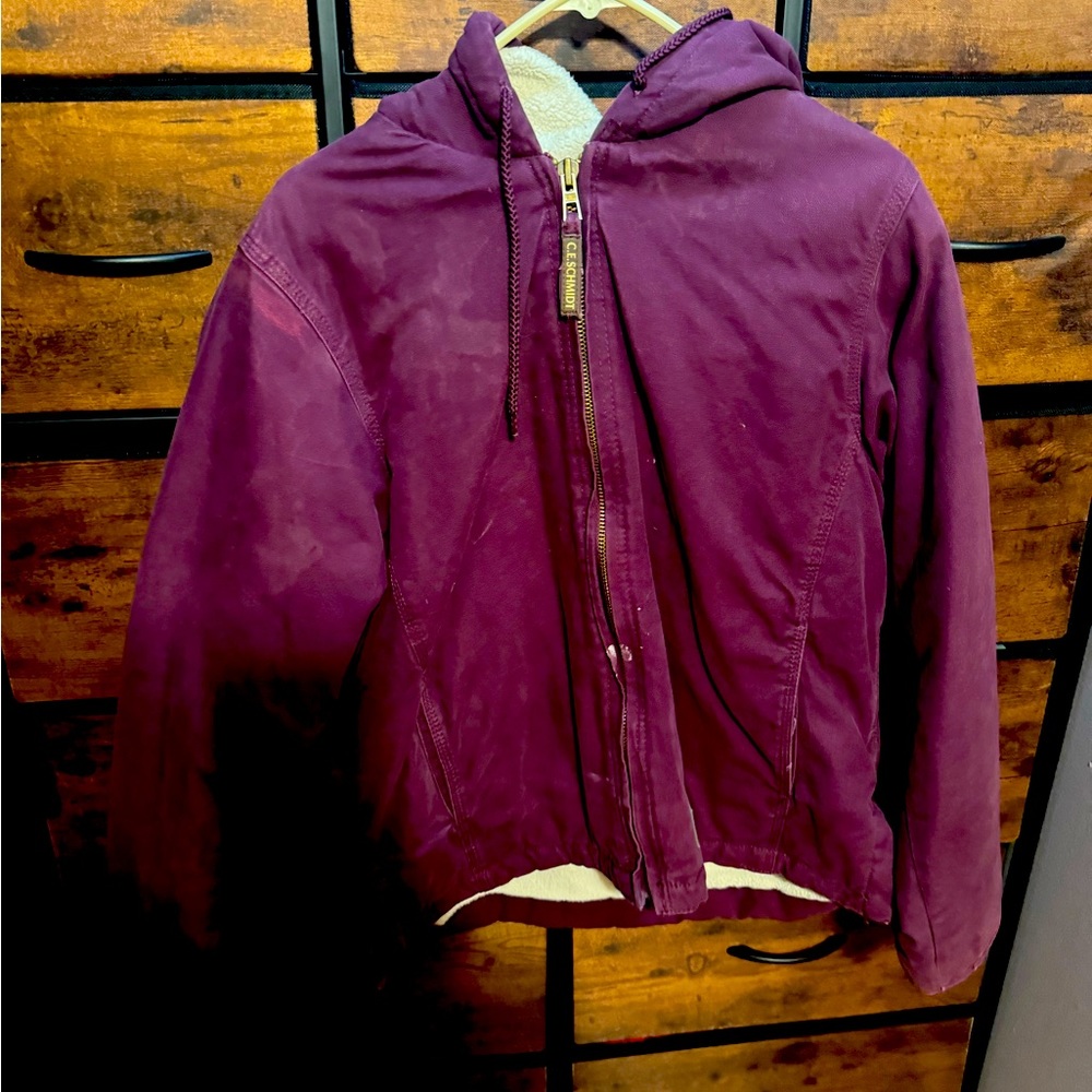 Maroon SCHMITS fleece lined jacket.
